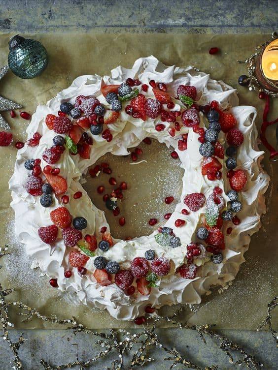 Christmas Pavlova - Best Christmas Desserts - Recipes and Christmas Treats to Try this Year! Try these amazing and cute easy Christmas dessert recipes to have a great party for your kids, friends, and family! Cupcakes, cakes, sweet bites, pies, brownies, home-made Christmas popcorn, Christmas cookies and other delights. #christmas #dessertfoodrecipes #xmas #recipes #food #christmasfood