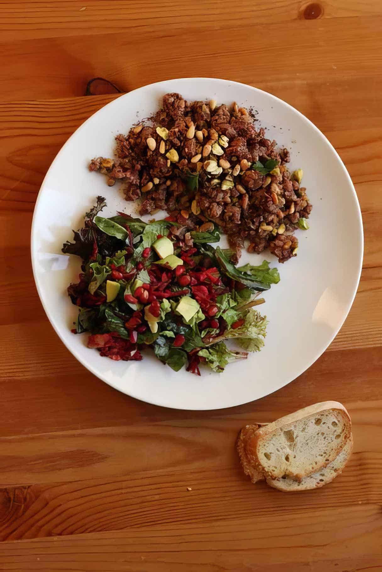 Ground Lamb with Chicken Stocks, Pistachios, Pine Nuts, Sumac, and a Side Salad